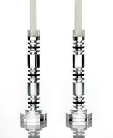 Columns of faceted crystal refract the light of the candle and that of the room, giving Aurora candlesticks their spectacular shine. Alternating small and large disks create a contemporary stacked design ideal for elegant decor. From Lighting by Design. Columns of faceted crystal refract the light of the candle and that of the room, giving Aurora candlesticks their spectacular shine. Alternating small and large disks create a contemporary stacked design ideal for elegant decor. From Lighting by Design.