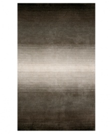 Crafted with an eye-catching ombre effect -- in which colors blend gradually into one another -- this hand-tufted area rug from Liora Manne has an organic flow that adds visual interest and irresistible allure to any floor. Crafted with an eye-catching ombre effect -- in which colors blend gradually into one another -- this hand-tufted area rug from Liora Manne has an organic flow that adds visual interest and irresistible allure to any floor.
