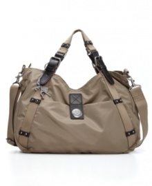 The Claudine is a versatile and stylish midsize handbag with chic leather trim that you can rock crossbody style or on the crook of your arm. The Claudine is a versatile and stylish midsize handbag with chic leather trim that you can rock crossbody style or on the crook of your arm.