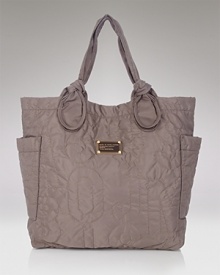 Casual, crinkled and cool, this tote features knotted straps,a sleek shape, and plenty of room for everything from magazines to makeup bags. Casual, crinkled and cool, this tote features knotted straps,a sleek shape, and plenty of room for everything from magazines to makeup bags.