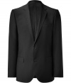 A classic from HUGO: the Aiko jacket - A basic blazer for nearly every man - Elegant jacket in fine virgin wool in classic black - New: modern, slim fit, slightly fitted at the waist - With slim falling, deep, back-stitched lapels - Two flap pockets and a chest pocket - Two-button front makes an especially beautiful, slim silhouette - A luxurious classic you can wear for a lifetime - Very high quality and particularly comfortable thanks to the stretch content - Ideal for countless occasions from casual to festive - Style: casual with jeans, classic with the matching suit pants - Cool: pair with a narrow tie