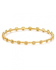 Embrace the season's eclectic approach to accessorizing with this hammered gold-plated bangle from Melinda Maria. Designed to add a touch of luxe to every look this piece is adorned with striking crystal stations.