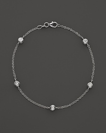 Diamond stations on a fine white gold chain bracelet.