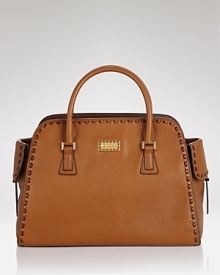 Bring a bright statement with Michael Kors' shapely leather satchel on your arm. With gold tone hardware and a vibrant hue, the bag is a cool color-pop with laid-back looks. Bring a bright statement with Michael Kors' shapely leather satchel on your arm. With gold tone hardware and a vibrant hue, the bag is a cool color-pop with laid-back looks.
