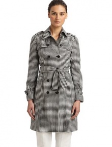 Youthful yet completely fashionable, this gingham design has a classic double breasted silhouette and tie-belt waist.Point collar with hook-and-eye closure Triangular button tab at collar Button down storm flap Shoulder epaulettes Long sleeves with belted cuffs Buckled belt at waist Dual vertical flap pockets Fully lined About 36 from shoulder to hem Rayon Dry clean Made in Italy Youthful yet completely fashionable, this gingham design has a classic double breasted silhouette and tie-belt waist.Point collar with hook-and-eye closure Triangular button tab at collar Button down storm flap Shoulder epaulettes Long sleeves with belted cuffs Buckled belt at waist Dual vertical flap pockets Fully lined About 36 from shoulder to hem Rayon Dry clean Made in Italy
