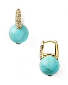 Take your lobes on a tropical vacation and opt for MICHAEL Michael Kors' turquoise earrings. The bright baubles punch up neutral palettes and all-black with island-inspired color.