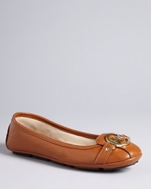 Sporty ballerina mocassins with signature MICHAEL Michael Kors ornamentation at toe.