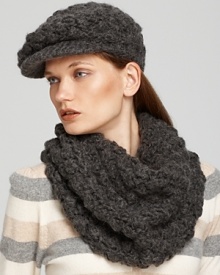 Add a textural element to your winter wardrobe with this chic popcorn knit newsboy cap from Michael Kors. Add a textural element to your winter wardrobe with this chic popcorn knit newsboy cap from Michael Kors.