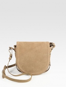 Sumptuous suede in a classic flap-saddle silhouette, finished with a versatile crossbody strap.Adjustable crossbody strap, 19-21 dropFlap closureCenter zip compartmentOne inside zip pocketFully lined7¾W X 8H X 2½DImported