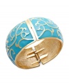 Stack your wrists with bold, vibrant styles. Charter Club's fancy bangle bracelet features a scrolling pattern in turquoise enamel. Crafted in gold tone mixed metal. Secures with a hinge clasp. Approximate diameter: 2-1/2 inches.