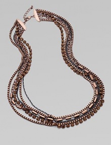 A six row, chunky, textural piece that is mixed in with glittering glass stones. Brass Length, about 30 Lobster clasp closure Imported A six row, chunky, textural piece that is mixed in with glittering glass stones. Brass Length, about 30 Lobster clasp closure Imported
