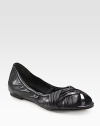 Ruched leather flat with a stretchy upper and unique peep toe. Leather upperLeather liningRubber solePadded insoleImportedOUR FIT MODEL RECOMMENDS ordering one half size down as this style runs large. 