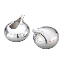 This Kurl Sugar and CreamerSet is ready to save the day with its forward-thinking design sensibility. Resembling miniaturecurling stones, these metal alloy pieces would make a wonderful housewarming or wedding gift. This Kurl Sugar and CreamerSet is ready to save the day with its forward-thinking design sensibility. Resembling miniaturecurling stones, these metal alloy pieces would make a wonderful housewarming or wedding gift.