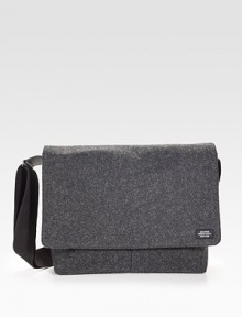 Sturdy and sleek in durable, water resistant waxed wool, detailed with leather trim and custom die-cast black hardware.Adjustable shoulder strapFlap closureLaptop interior pocket with tab closureOrganizing pocketsInterior zipper pocketsCotton liningWaxed wool exterior14 X 14 X 3Imported Sturdy and sleek in durable, water resistant waxed wool, detailed with leather trim and custom die-cast black hardware.Adjustable shoulder strapFlap closureLaptop interior pocket with tab closureOrganizing pocketsInterior zipper pocketsCotton liningWaxed wool exterior14 X 14 X 3Imported