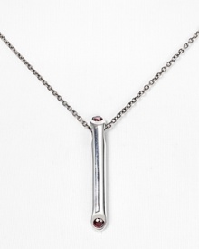 Add cool-girl cred to your jewel box with Elizabeth and James' garnet-encrusted pendant. Wear this silvery style with a silky blouse, layering other striking styles to work an eclectic edge. Add cool-girl cred to your jewel box with Elizabeth and James' garnet-encrusted pendant. Wear this silvery style with a silky blouse, layering other striking styles to work an eclectic edge.
