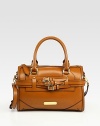 Tailored elegance in rich calfskin with buckle strap detail and gleaming hardware.Double top handles, 5 dropAdjustable, detachable buckle shoulder strap, 21-22 dropTop zip close with tab pullProtective metal feetOutside buckle straps and signature plaqueOne inside zip pocket and two inside open pocketsCotton check lining12W X 7¾H X 6½DMade in Italy