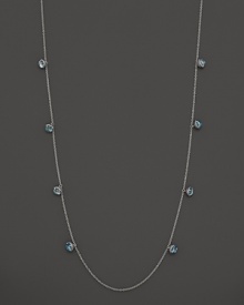 Inspired by Zen philosophy, this intricately detailed sterling silver necklace from Paul Morelli softly jingles with eight meditation bells and cabochons of blue topaz. Inspired by Zen philosophy, this intricately detailed sterling silver necklace from Paul Morelli softly jingles with eight meditation bells and cabochons of blue topaz.