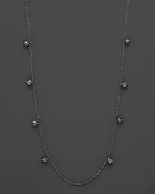 Inspired by Zen philosophy, this intricately detailed sterling silver necklace from Paul Morelli softly jingles with eight meditation bells. Inspired by Zen philosophy, this intricately detailed sterling silver necklace from Paul Morelli softly jingles with eight meditation bells.