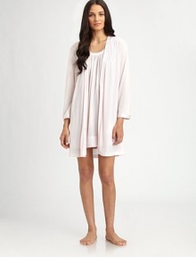 This ultra-comfortable layering piece is a simple yet elegant design, with a hint of sheen at the neckline, waist and cuffs. Long sleeves with dropped shouldersShiny trim at neckline and cuffsSelf-tie waistAbout 36 from shoulder to hem65% polyester/35% rayonMachine washImported This ultra-comfortable layering piece is a simple yet elegant design, with a hint of sheen at the neckline, waist and cuffs. Long sleeves with dropped shouldersShiny trim at neckline and cuffsSelf-tie waistAbout 36 from shoulder to hem65% polyester/35% rayonMachine washImported