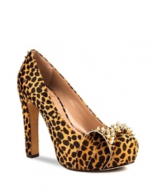 VINCE CAMUTO's Jamma platforms are not-so-sweet--a girlish bow is toughened up with spiked gold-tone studs.