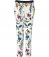 Stylish pants in fine cream-colored silk, featuring an eye-catching multicolored floral wallpaper print - Side and back slit pockets, hidden hook and button closure, pleated front, black waistband, belt loops - Relaxed, tapered cut - The perfect choice for day and evening - style with a solid blouse, leather jacket and platform pumps