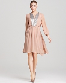 With a shimmering sequin-embellished neckline, this blush-hued French Connection dress proves that neutrals are anything but boring. Wear with platform pumps and a simple clutch for easy evening glamour.