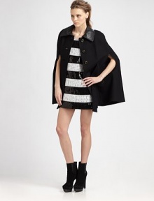 Wool-rich statement piece has leather trim, a plethora of pockets and waist-cinching self tie. Leather point collarCape sleevesButton frontFront self tieDual flap pockets; besom pocketsFully linedAbout 30 from shoulder to hem65% wool/35% viscoseDry cleanImportedModel shown is 5'10 (177cm) wearing US size 4. Wool-rich statement piece has leather trim, a plethora of pockets and waist-cinching self tie. Leather point collarCape sleevesButton frontFront self tieDual flap pockets; besom pocketsFully linedAbout 30 from shoulder to hem65% wool/35% viscoseDry cleanImportedModel shown is 5'10 (177cm) wearing US size 4.