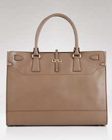 Salvatore Ferragamo's supple leather tote features a sharply structured design. Ideal with daytime looks, this go-anywhere bag is oh so chic with both dresses and jeans. Salvatore Ferragamo's supple leather tote features a sharply structured design. Ideal with daytime looks, this go-anywhere bag is oh so chic with both dresses and jeans.