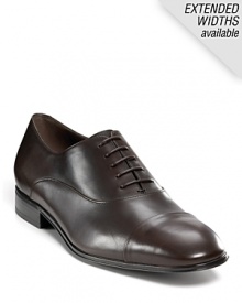 Classic cap toe oxfords, crafted from fine leather. Lace-up leather upper. Leather lined and sole. Slight stacked heel. Signature gancini embossed on heel. Classic cap toe oxfords, crafted from fine leather. Lace-up leather upper. Leather lined and sole. Slight stacked heel. Signature gancini embossed on heel.
