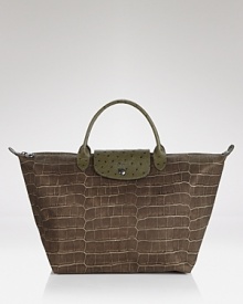 Lonchamp's croc-embossed Le Pliage handbag shows off with ostrich-embossed accents. Lonchamp's croc-embossed Le Pliage handbag shows off with ostrich-embossed accents.