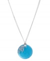 A drop of bold color adds flair to any look. Kenneth Cole New York's circular pendant is crafted from turquoise resin and accented by a dusting of crystals. Set in silver tone mixed metal. Approximate length: 16 inches + 3-inch extender. Approximate drop: 1-3/4 inches.