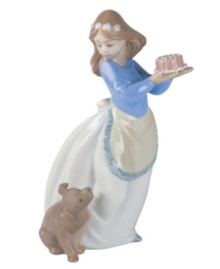 An adorably curious pup looks forward to his own celebration in this charming handmade figurine from Lladró. An adorably curious pup looks forward to his own celebration in this charming handmade figurine from Lladró.