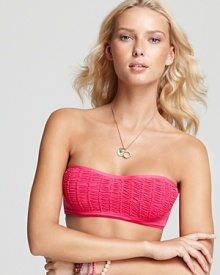 Interchangeable swimwear is a must for the seasoned sunbather, and this solid smocked bandeau top from Juicy Couture is a playful way to be a mix and match master. Interchangeable swimwear is a must for the seasoned sunbather, and this solid smocked bandeau top from Juicy Couture is a playful way to be a mix and match master.