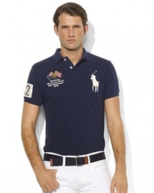 A trim-fitting polo shirt in breathable cotton mesh is finished with bold country details and Ralph Lauren's signature Big Pony. A trim-fitting polo shirt in breathable cotton mesh is finished with bold country details and Ralph Lauren's signature Big Pony.