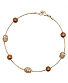 Round out your look with sparkle and shine. This Monet bracelet features glass pearls and crystal accents set in goldtone mixed metal. Approximate length: 7 inches.