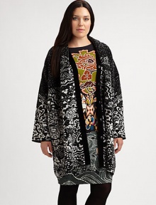 Featuring a pretty floral print in timeless black and white, this cocoon coat is guaranteed to be the piece that completes virtually any of your outfits. Snap closureLong sleevesAbout 37 from shoulder to hem60% wool/32% viscose/8% polyamideDry cleanMade in Italy