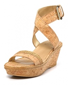 Natural cork gets adorned with woven trim, exuding earthy style in a chic silhouette. From Stuart Weitzman.