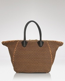 This embossed leather bag from Pour La Victoire takes the tote to exotic extremes. Whether you're carrying on or simply in need of a cool carryall, this sizable style is wildly chic. This embossed leather bag from Pour La Victoire takes the tote to exotic extremes. Whether you're carrying on or simply in need of a cool carryall, this sizable style is wildly chic.