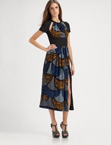 This singular style boasts intriguing cutouts and a graphic, retro-inspired print.Banded jewel necklineShort sleevesGathered front bib with cutout detailsGathered skirtFront slitBack cutout with single button closureBack zipFully linedAbout 35 from natural waist90% viscose/10% elastaneDry cleanMade in ItalyModel shown is 5'9½ (176cm) wearing US size 4. This singular style boasts intriguing cutouts and a graphic, retro-inspired print.Banded jewel necklineShort sleevesGathered front bib with cutout detailsGathered skirtFront slitBack cutout with single button closureBack zipFully linedAbout 35 from natural waist90% viscose/10% elastaneDry cleanMade in ItalyModel shown is 5'9½ (176cm) wearing US size 4.