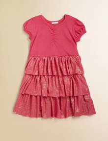 This adorable knit is sweetly gathered on top and wonderfully tiered on the bottom, with wide rows of shimmering ruffles.Smooth jersey top with gathered V necklinePuff sleevesSparkle tiered skirt50% cotton/50% modalMachine washImported