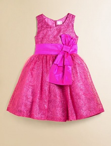 A stunning silhouette featuring allover swirling sequins and a dramatic bow front.ScoopneckSleevelessSilk sash with bow detail and back button closureFull skirt with crinoline under layerConcealed back zipperPolyesterDry cleanMade in USA of imported fabric