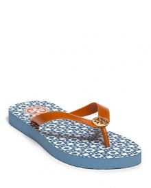 A geometric patterned footbed lends graphic punch to the Tory Burch Isidro flip flops.