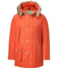 Stylish and sporty rust down coat in a washable cotton blend from the American heritage label Woolrich - Tapers slightly at waist, hits at mid-thigh - Rabbit fur collar lends this coat a veritable feeling of warmth and luxe - Water and snow resistant, with multiple pockets and hood - Exceptionally warm, can be worn in temperatures as low as -30 F - A versatile, classic coat perfect for both city streets and country slopes