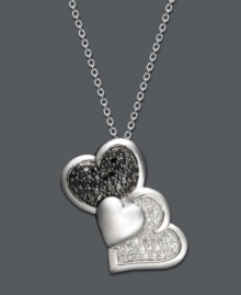 This Treasured Hearts design puts a modern twist on the iconic heart symbol. Three, overlapping hearts shine with the addition of round-cut black diamonds (1/5 ct. t.w.) and white diamonds (1/6 ct. t.w.). Setting and chain crafted in sterling silver. Approximate length: 18 inches. Approximate drop: 1 inch.