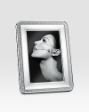 Elegantly appointed, polished silverplated design gives proper attention to a favorite 4 X 6 photograph. From the Malmaison Collection A terrific gift idea Wood base Made in Italy