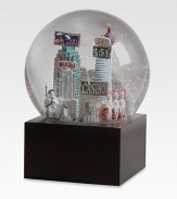 EXCLUSIVELY OURS. The Las Vegas musical snowglobe features city scenes and landmarks, including: Hoover DamStratosphereElvis impersonatorShowgirlsCasinoStatue of LibertyCasino-style Sphinx and PyramidPlays Luck Be A LadyImported