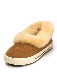 Wear these sporty slippers with a sneaker-like bottom indoors or outdoors! With genuine shearling cuffs for a cozy touch. Wear these sporty slippers with a sneaker-like bottom indoors or outdoors! With genuine shearling cuffs for a cozy touch.