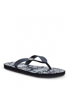 An ikat-printed footbed adds a worldly touch to a summer-comfort sandal from UGG® Australia.