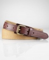 Supple leather tabs and an antiqued metal roller buckle lend relaxed refinement to a cotton web belt.