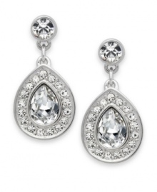 Classic elegance that adds versatility to your wardrobe. These Swarovski earrings feature a pear-shaped crystal framed in clear crystal pave. Crafted in rhodium-plated mixed metal. Approximate drop: 3/4 inch.